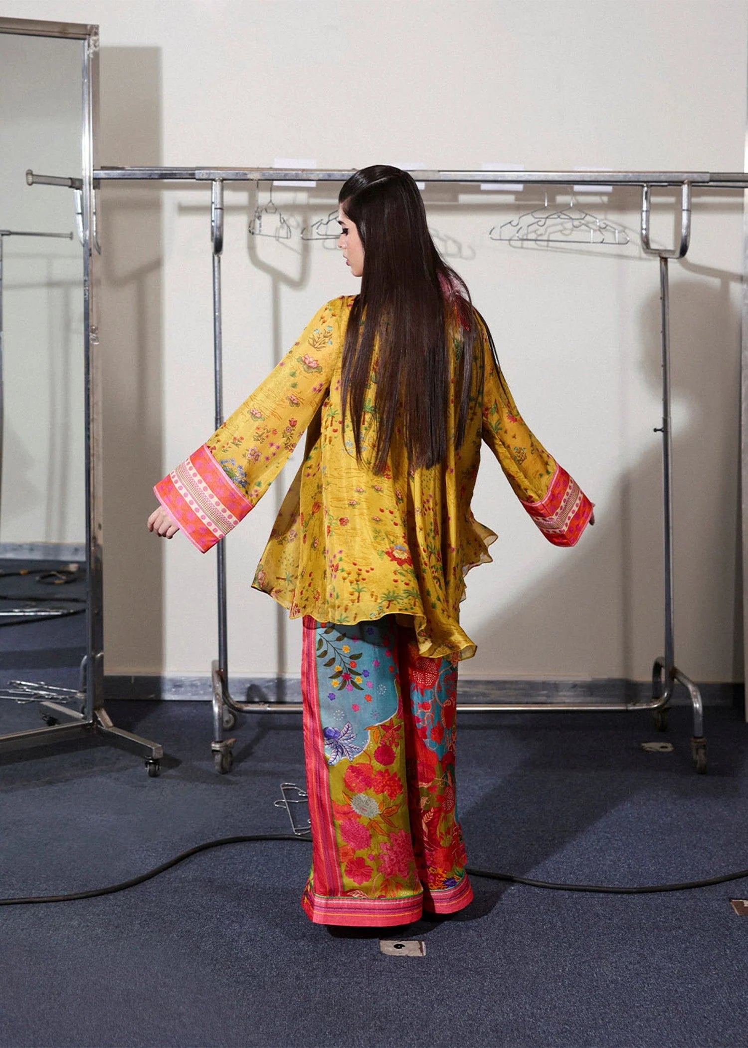 Model wearing mustard yellow and multicolor Aurora set from Hussain Rehar PAY DAY VOL - V, perfect Pakistani luxury pret in the UK.